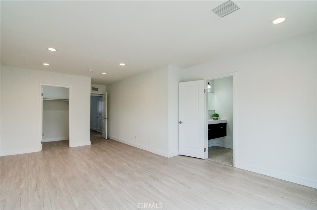 4541 Myra Avenue Cypress, CA 90630 - Photo 30 of 42 an empty room with closet and a bathroom