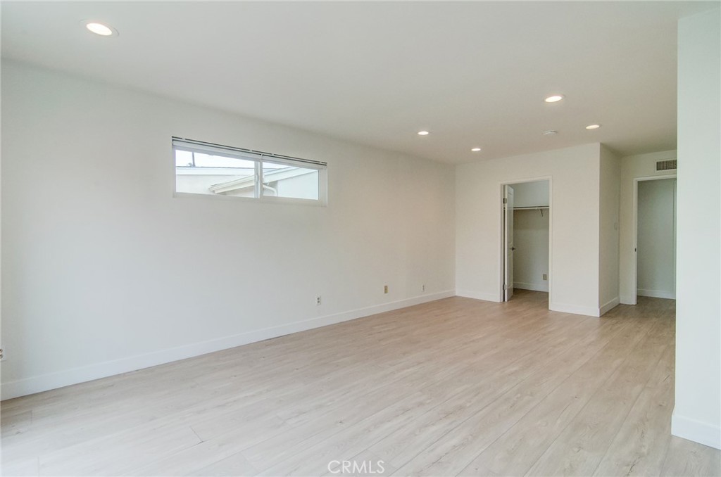 4541 Myra Avenue Cypress, CA 90630 - Photo 31 of 42 an empty room with closet and a window