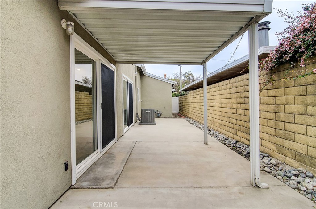 4541 Myra Avenue Cypress, CA 90630 - Photo 36 of 42 a view of a pathway door of the house