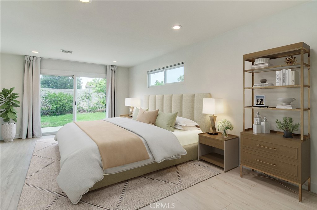4541 Myra Avenue Cypress, CA 90630 - Photo 6 of 42 a bed room with a bed and a large window