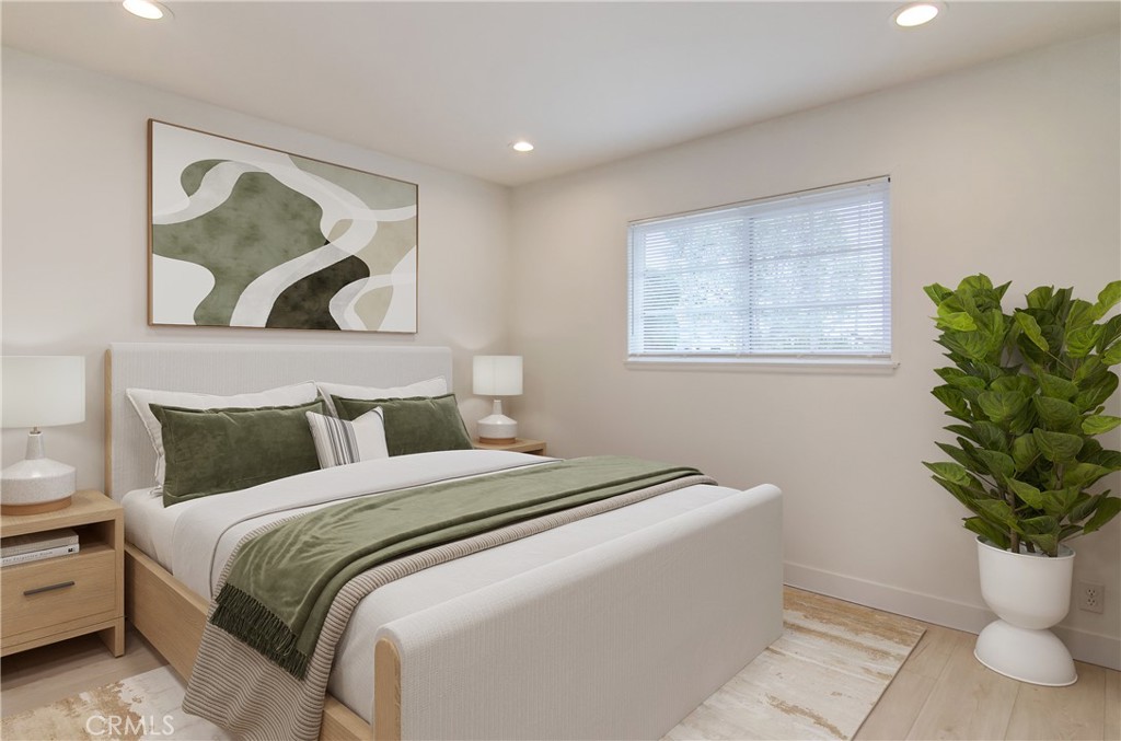 4541 Myra Avenue Cypress, CA 90630 - Photo 7 of 42 a bedroom with a bed and a painting on the wall