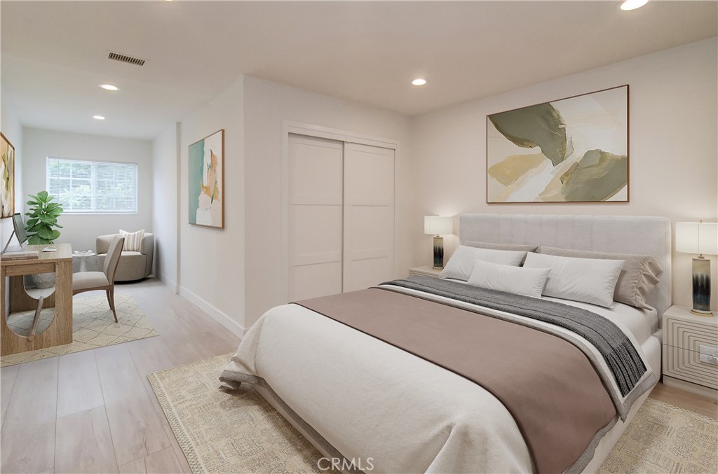 4541 Myra Avenue Cypress, CA 90630 - Photo 8 of 42 a bedroom with a bed and a painting on the wall