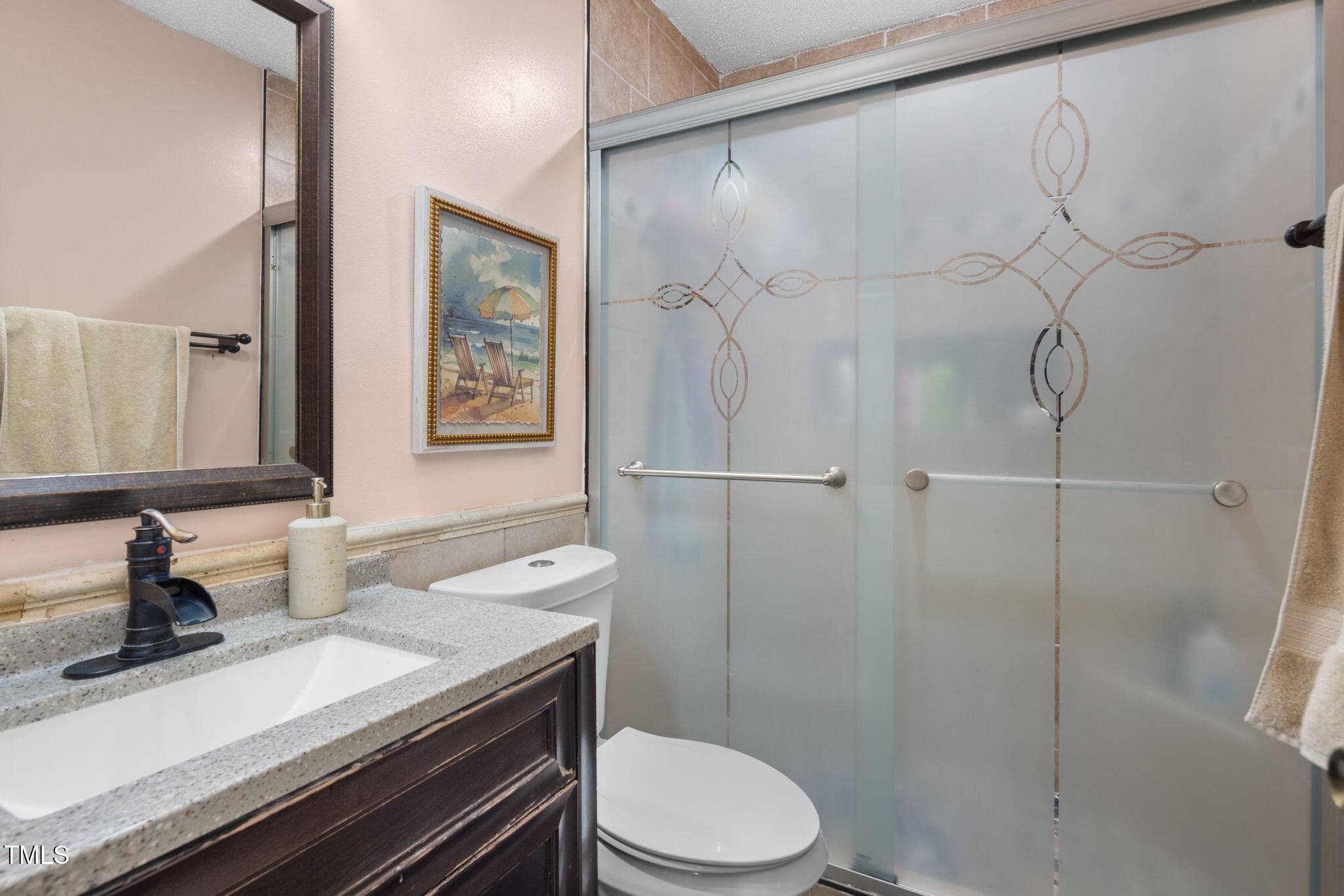 505 Stratton Way Durham, NC 27704 - Photo 13 of 34 a bathroom with a sink a toilet and shower