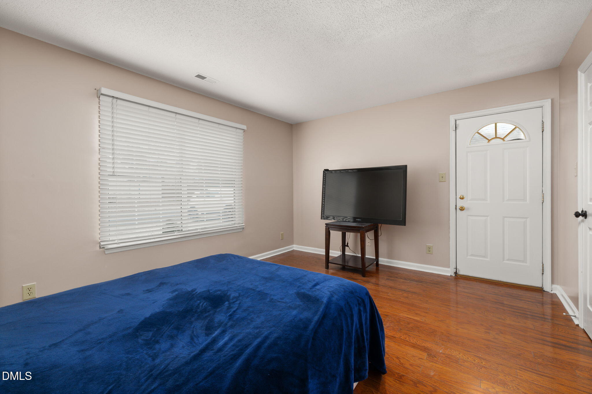 505 Stratton Way Durham, NC 27704 - Photo 14 of 34 a bedroom with a bed tv and a table