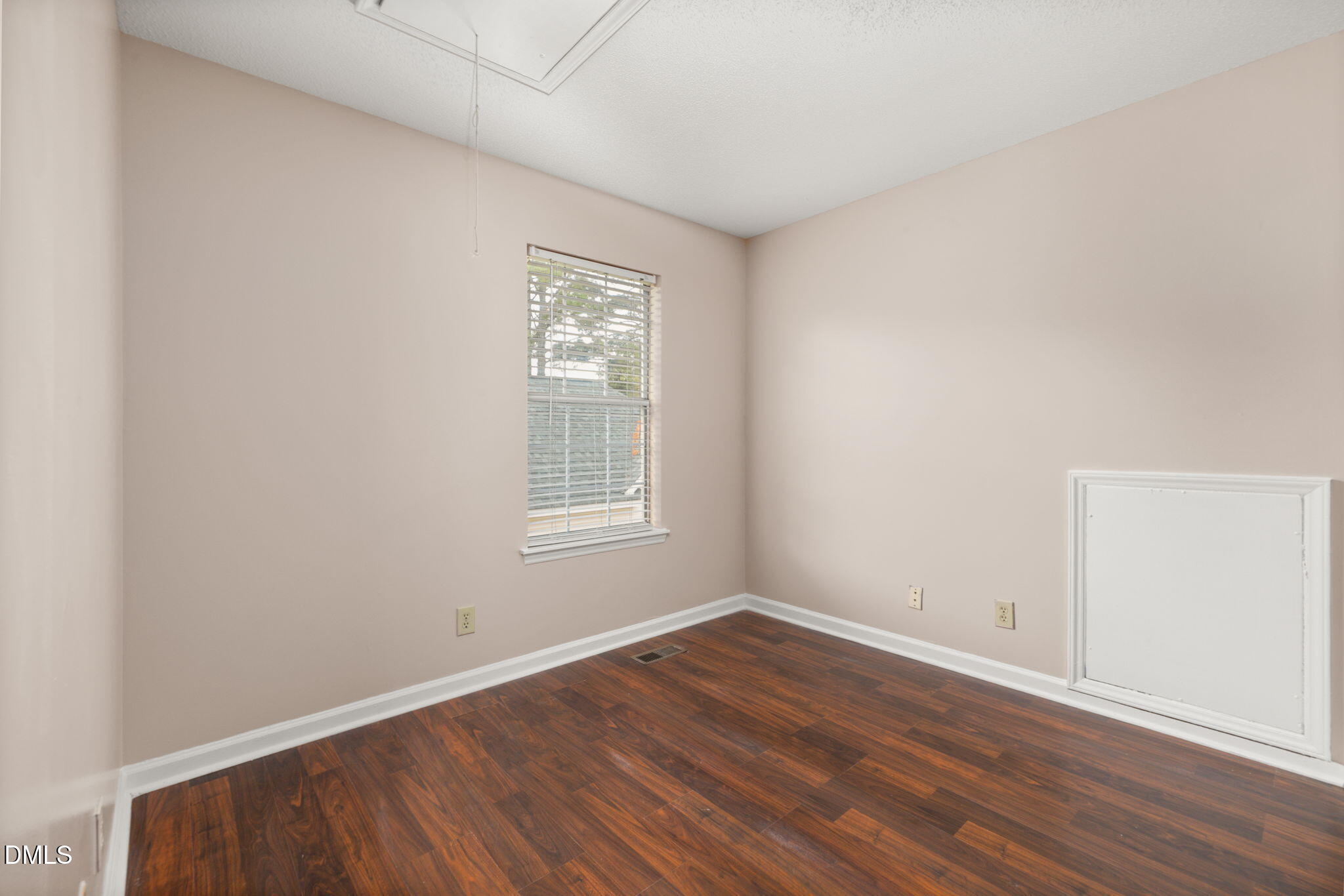 505 Stratton Way Durham, NC 27704 - Photo 19 of 34 an empty room with wooden floor and windows