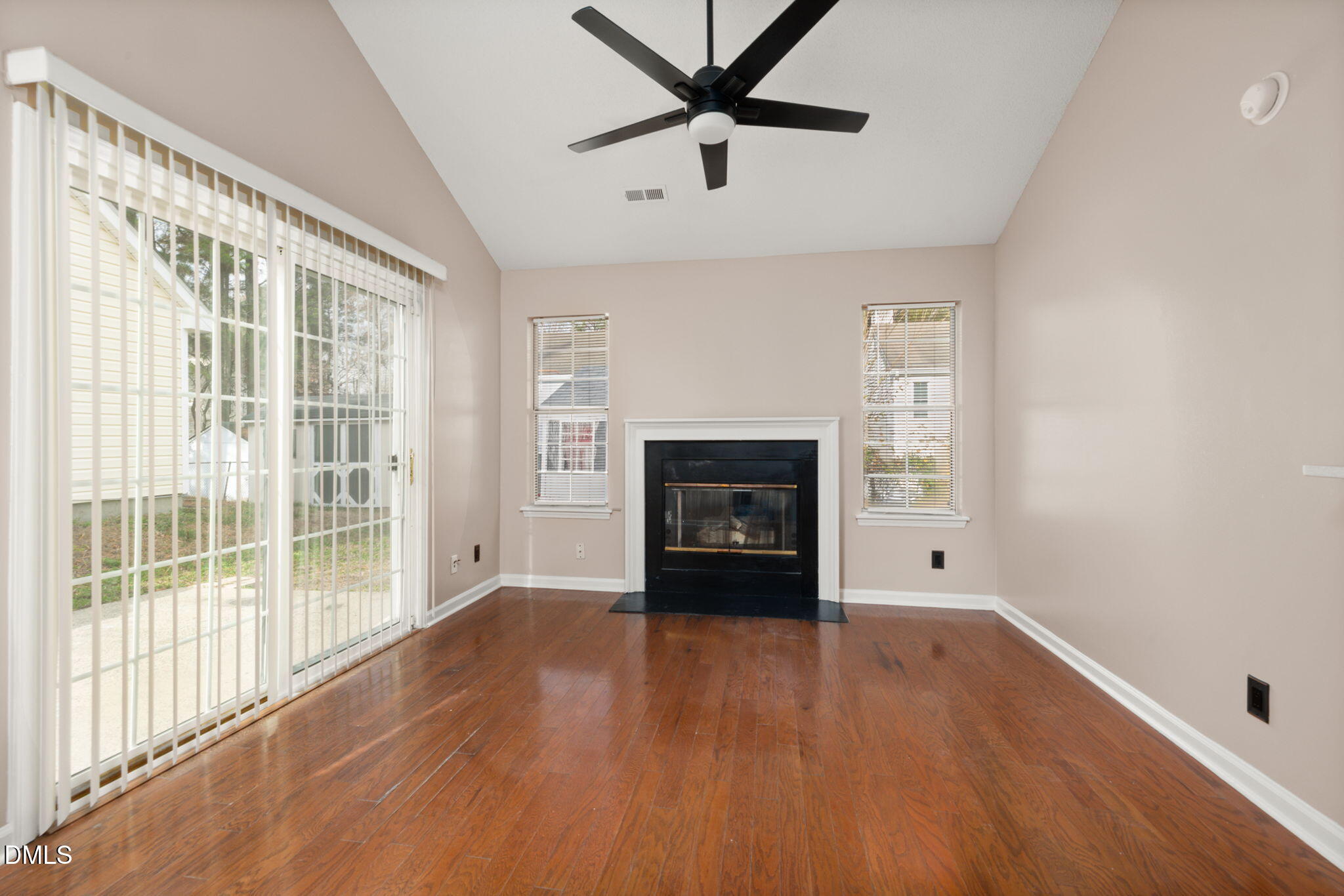 505 Stratton Way Durham, NC 27704 - Photo 2 of 34 a view of empty room with wooden floor and fireplace