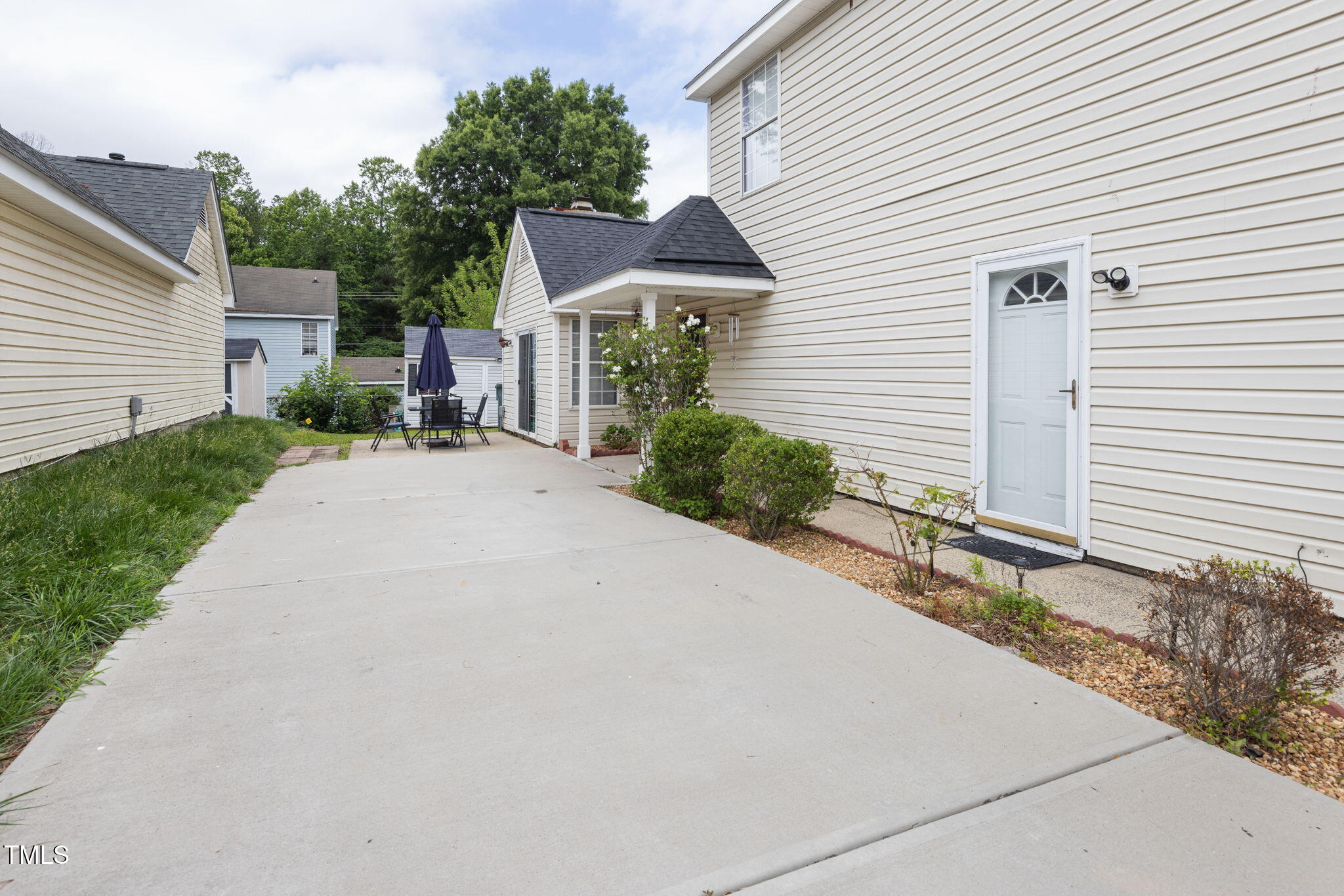 505 Stratton Way Durham, NC 27704 - Photo 23 of 34 a front view of a house with a yard and garage