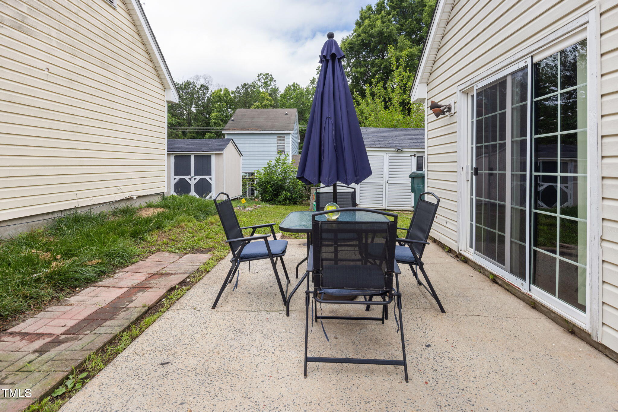 505 Stratton Way Durham, NC 27704 - Photo 25 of 34 a view of backyard with outdoor seating and plants