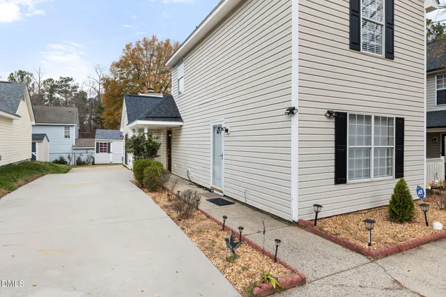 a view of a white house with a large windows