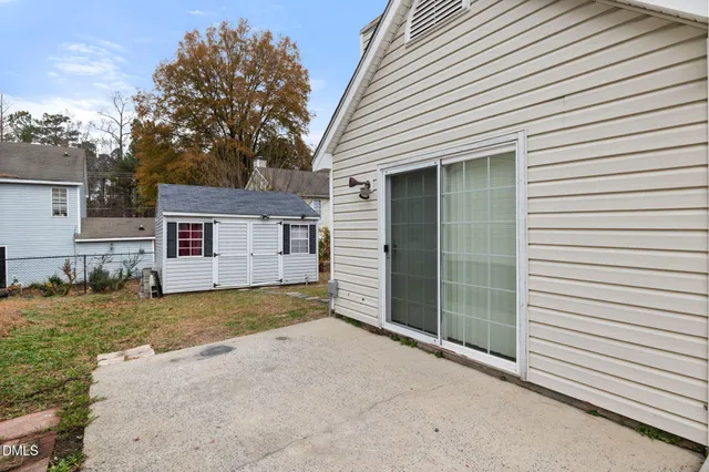 a view of a house with a yard and garage