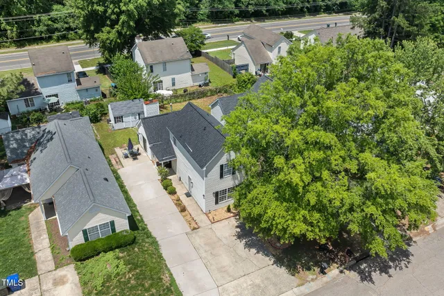 an aerial view of a house with a garden