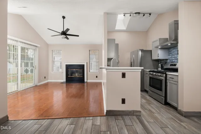 a kitchen with a stove and a refrigerator