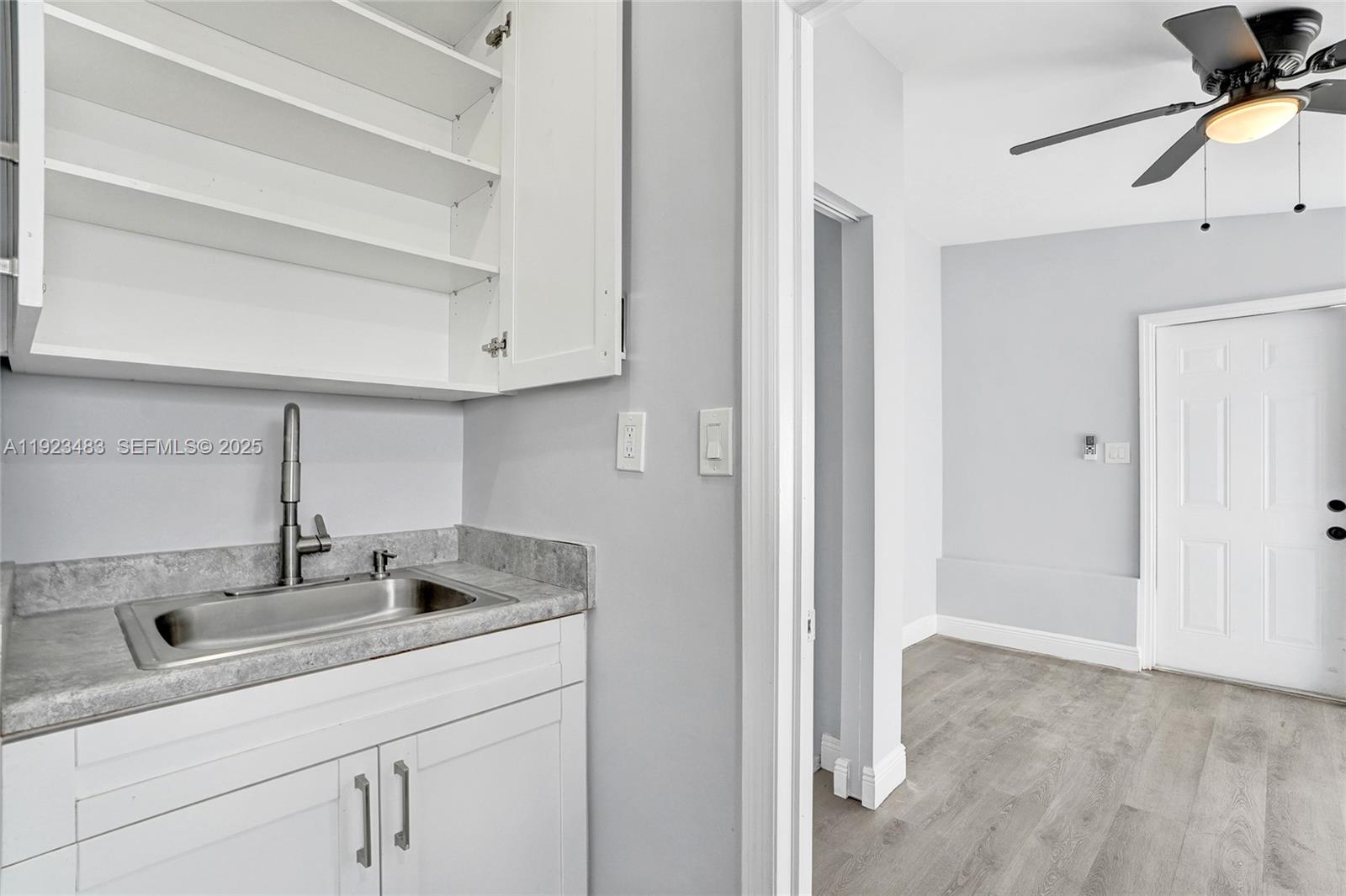 3633 Southwest 12th Court, Unit 1 Fort Lauderdale, FL 33312 - Photo 3 of 6 a kitchen with a sink and cabinets
