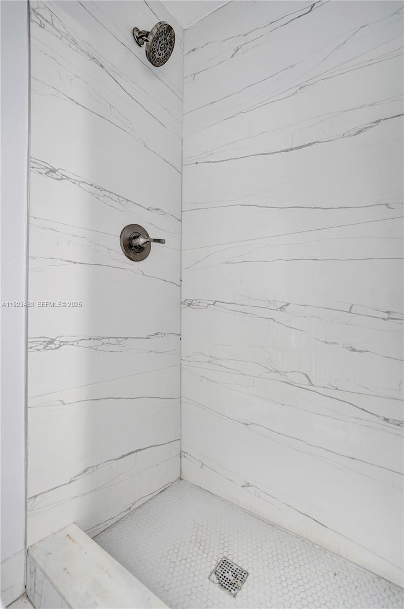 3633 Southwest 12th Court, Unit 1 Fort Lauderdale, FL 33312 - Photo 5 of 6 a bathroom with a bathtub