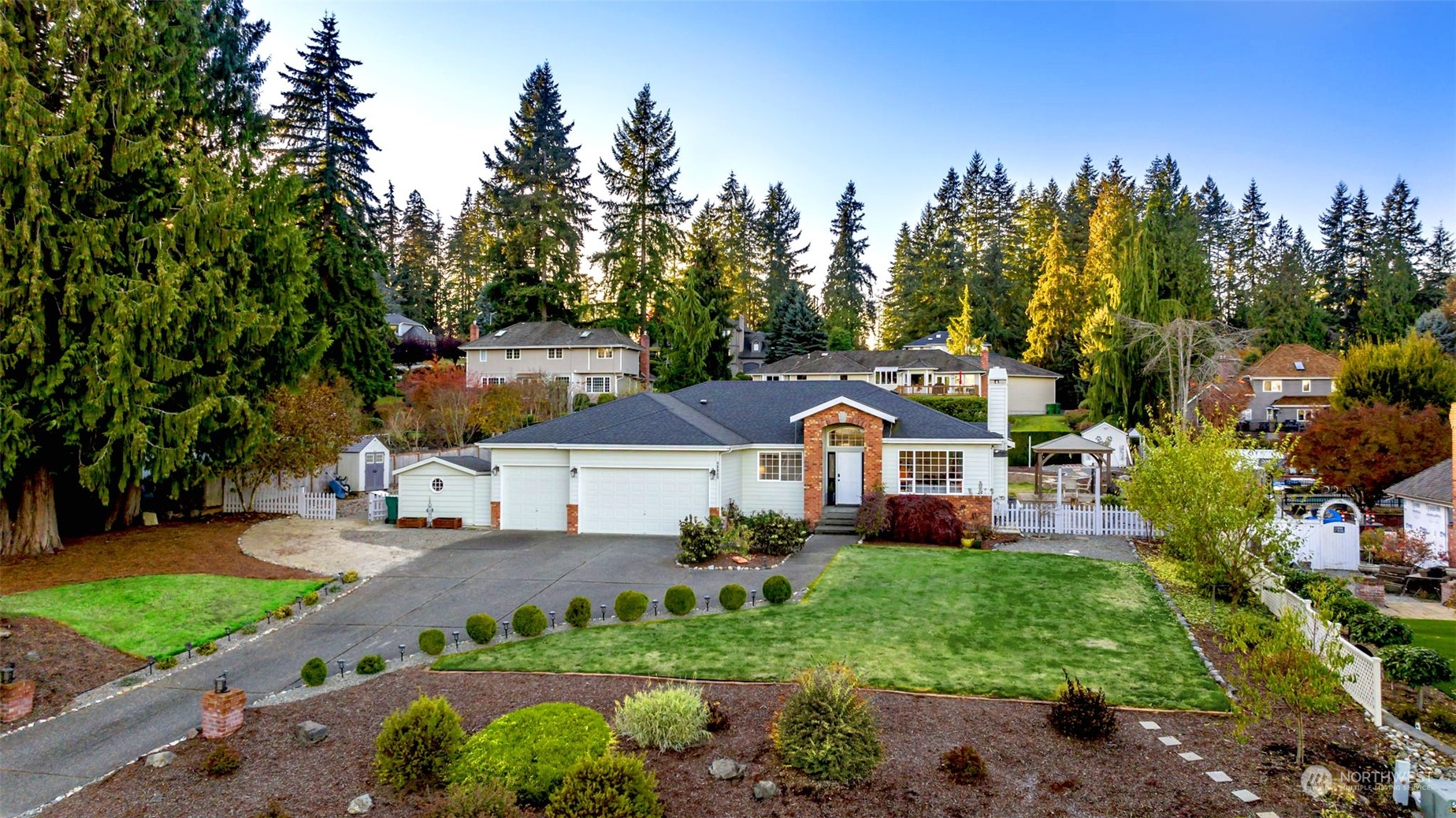 21122 49th Avenue Southeast Bothell, WA 98021 - Photo 1 of 1 a front view of a house with a yard and trees