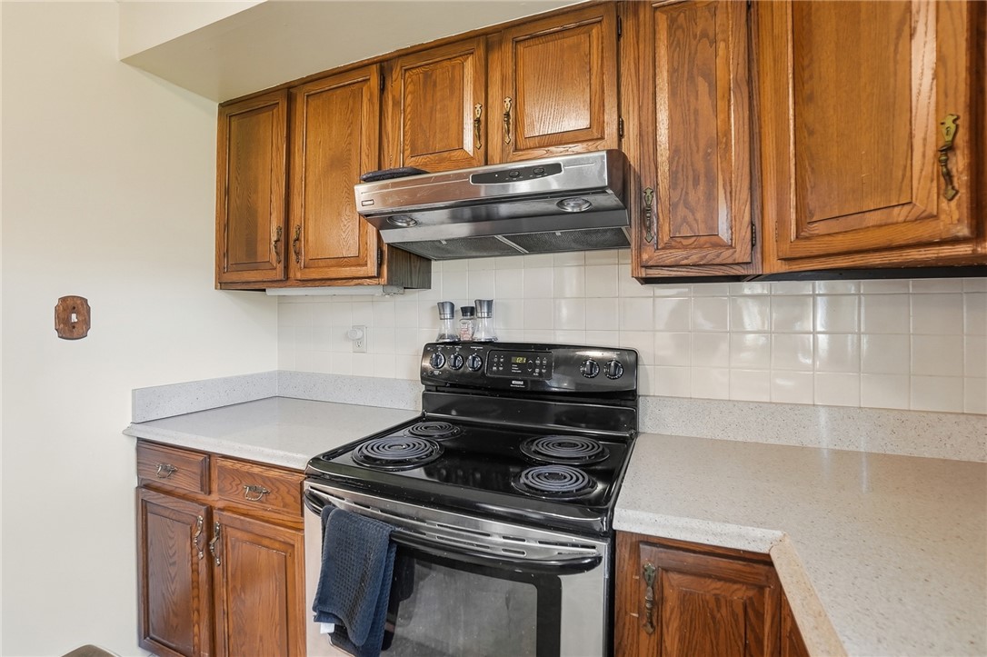 6225 Possum Run Road Bellbrook, OH 45305 - Photo 13 of 33 This functional kitchen features ample cabinetry and practical appliances, ready for culinary endeavors.