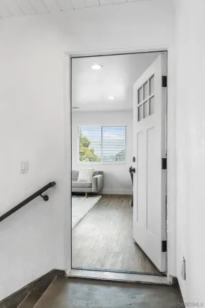 a view of a livingroom with furniture and a window