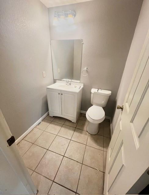 5205 Hudson Bend Road Austin, TX 78734 - Photo 11 of 21 a white toilet sitting next to a bathroom sink