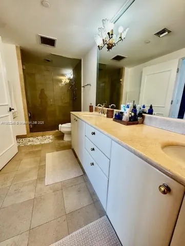 a large bathroom with a tub sink and mirror