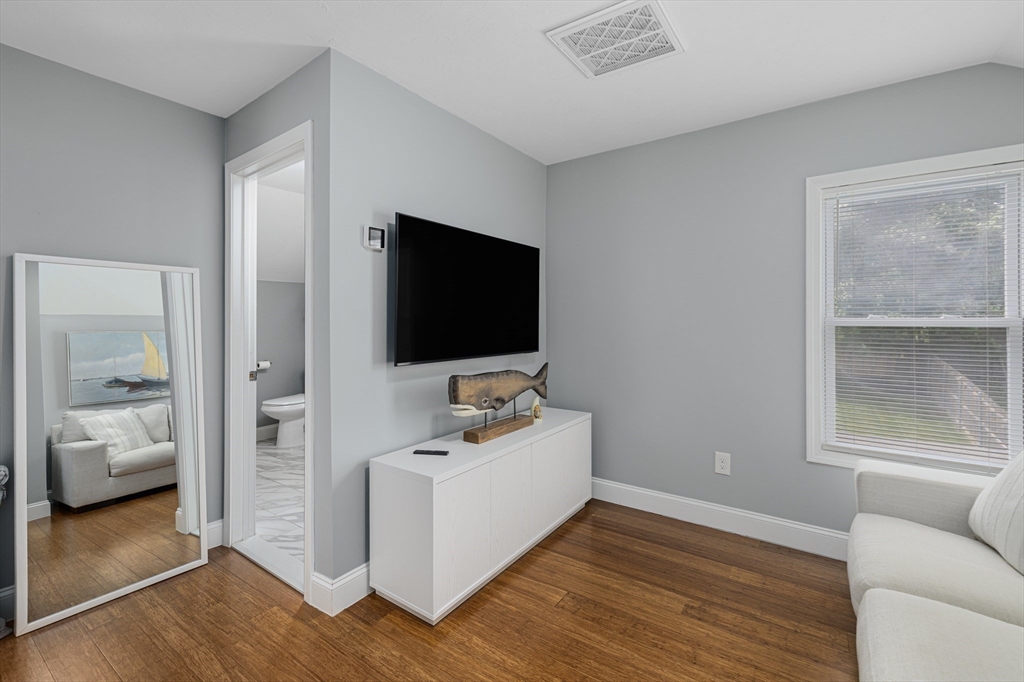 69 Denver Street Fall River, MA 02721 - Photo 28 of 35 a bedroom with furniture and flat screen tv