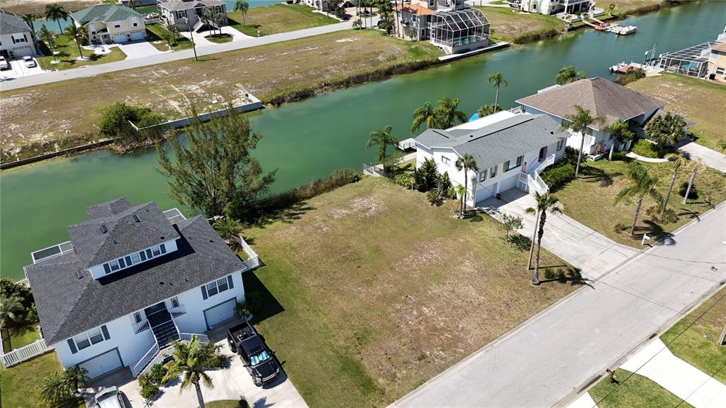 an aerial view of a house with a lake view