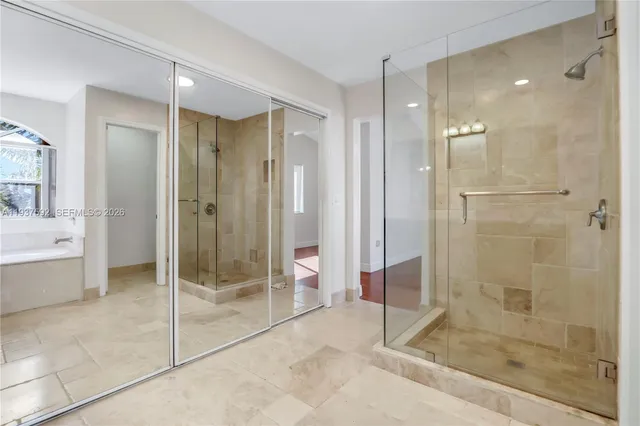 a bathroom with a shower and a sink