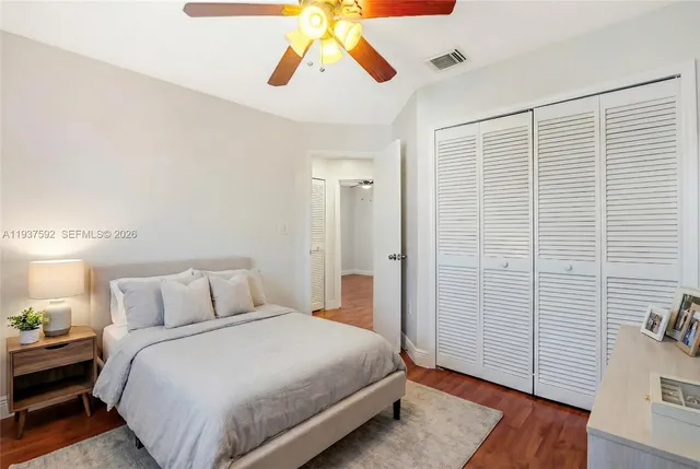 a bedroom with a bed and a walk in closet