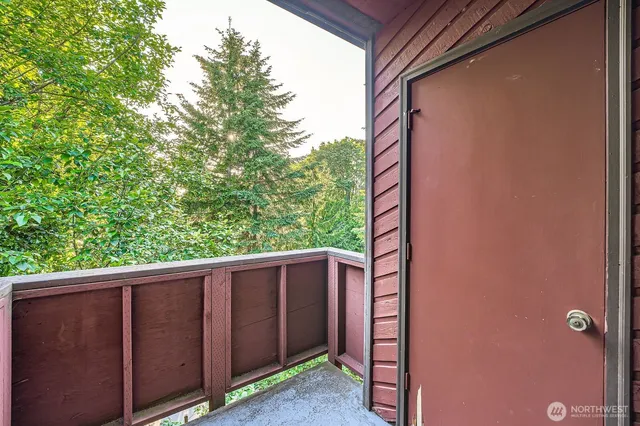 a view of a wooden fence and trees