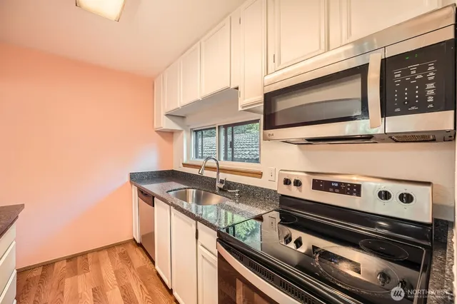 a kitchen with a stove and a microwave
