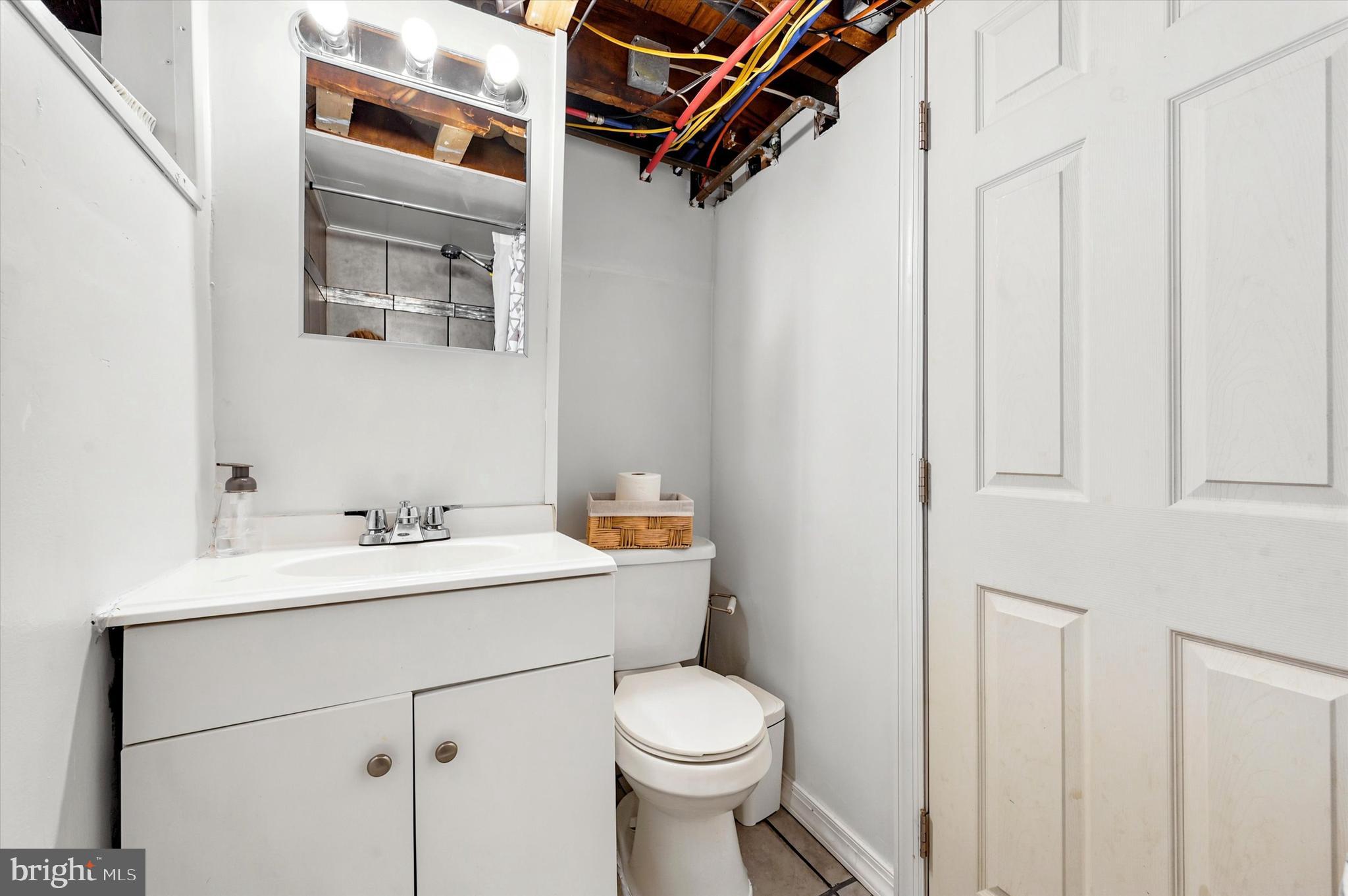 1210 Harding Drive Havertown, PA 19083 - Photo 21 of 25 a bathroom with a toilet sink and mirror