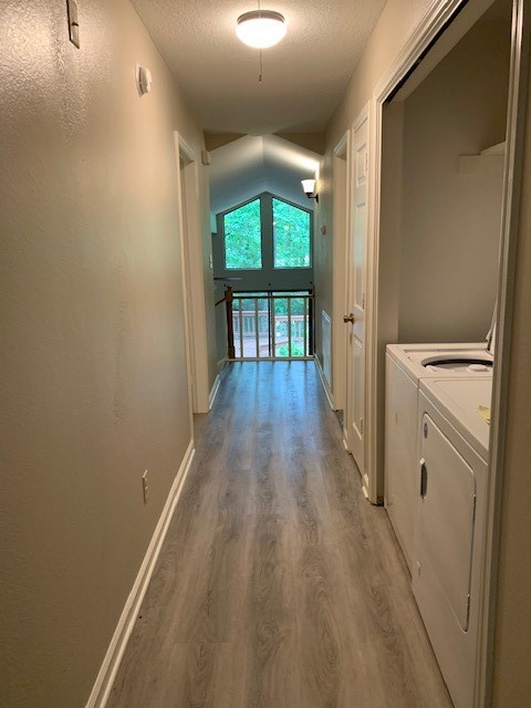 420 Nursery Road Spring, TX 77380 - Photo 11 of 26 a view of a hallway with wooden floor and a living room