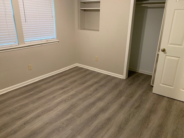 420 Nursery Road Spring, TX 77380 - Photo 15 of 26 an empty room with wooden floor and windows