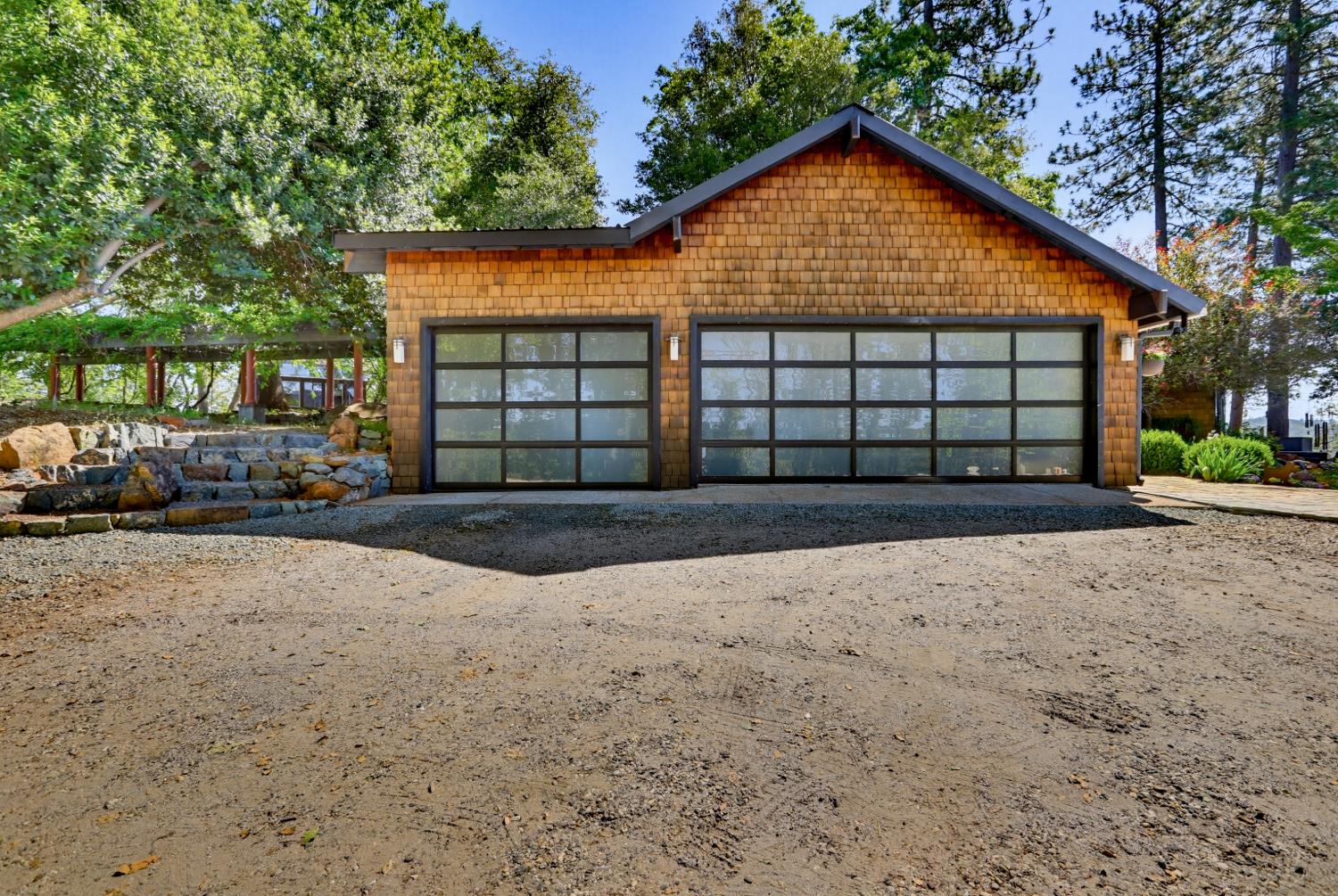 20111 Tanglewood Road Grass Valley, CA 95945 - Photo 92 of 93 a front view of a house with a yard and garage