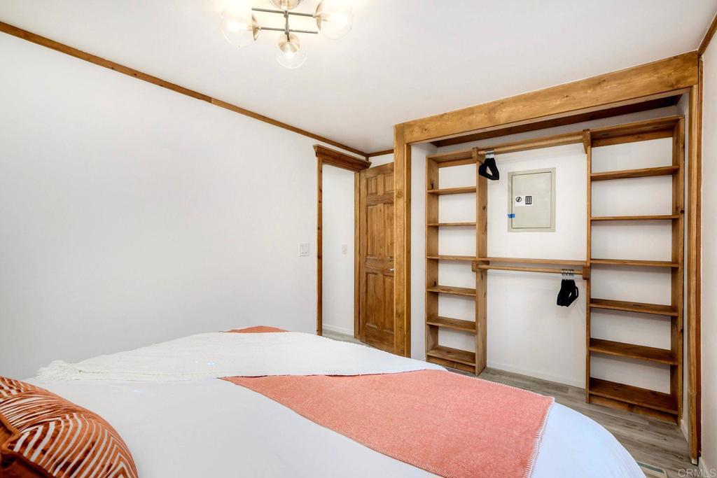 123 Jasper Street, Unit 35 Encinitas, CA 92024 - Photo 11 of 28 a bedroom with a bed and a walk in closet