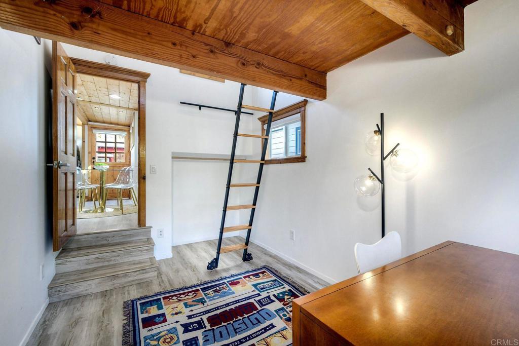 123 Jasper Street, Unit 35 Encinitas, CA 92024 - Photo 20 of 28 a room with furniture and wooden floor