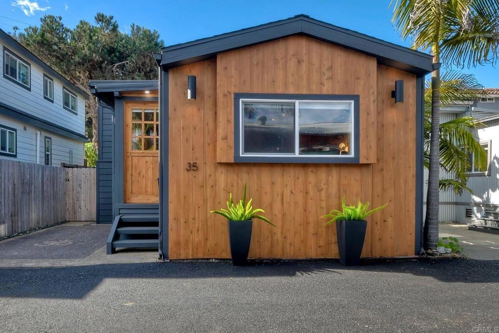 123 Jasper Street, Unit 35 Encinitas, CA 92024 - Photo 2 of 28 a front view of a house with garden