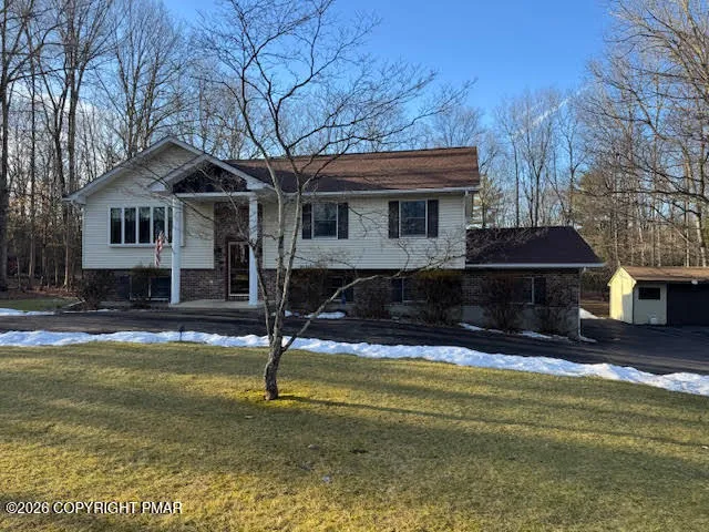 a front view of a house with swimming pool