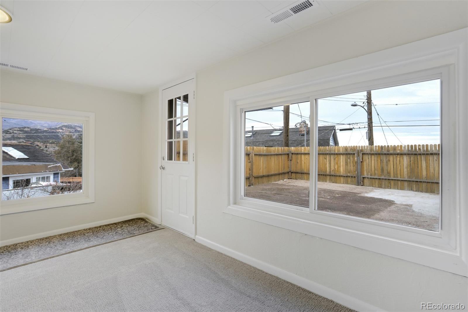 202 Oklahoma Road Manitou Springs, CO 80829 - Photo 16 of 41 a view of an empty room with a window