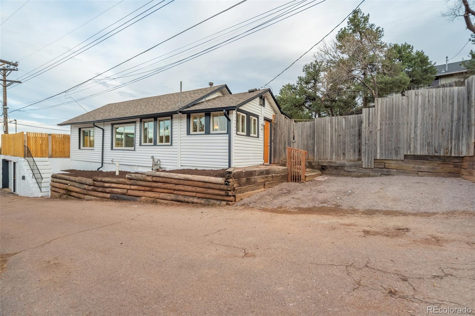 202 Oklahoma Road Manitou Springs, CO 80829 - Photo 2 of 41 a view of a house with a yard