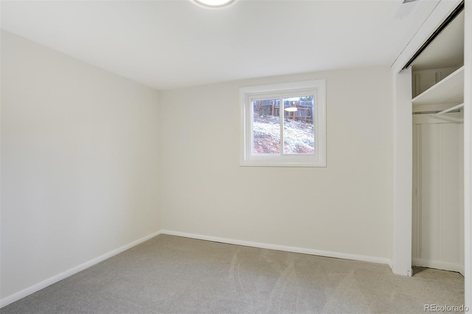 202 Oklahoma Road Manitou Springs, CO 80829 - Photo 22 of 41 an empty room with a window