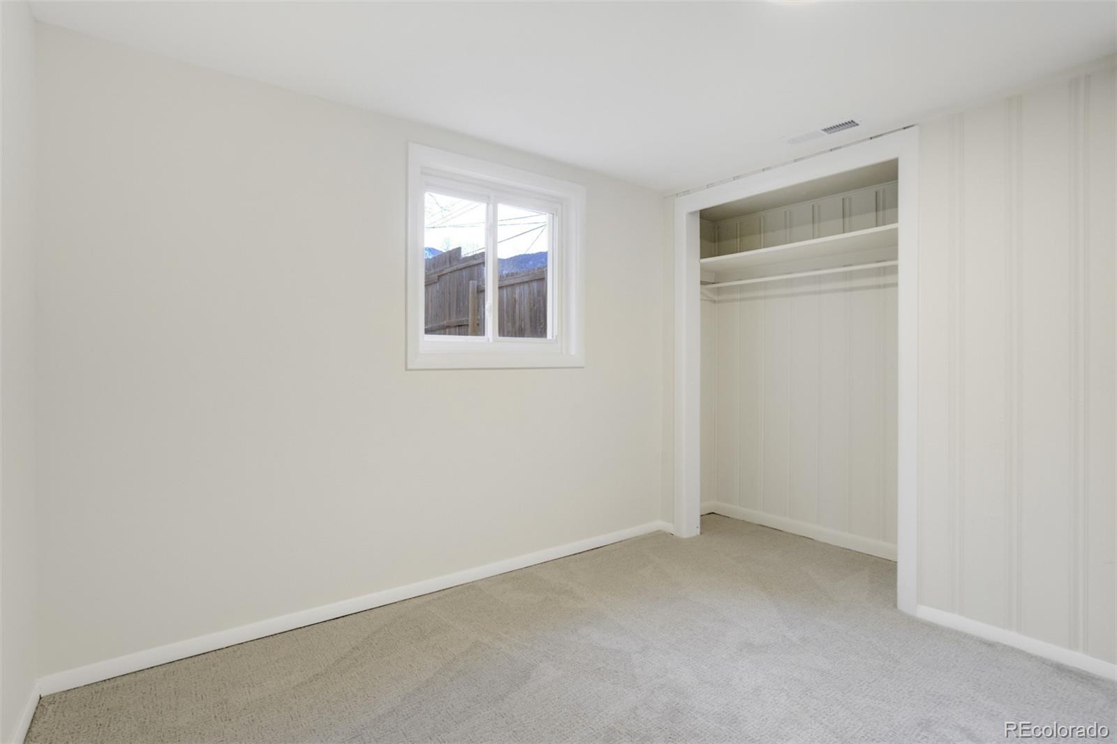 202 Oklahoma Road Manitou Springs, CO 80829 - Photo 23 of 41 an empty room with windows