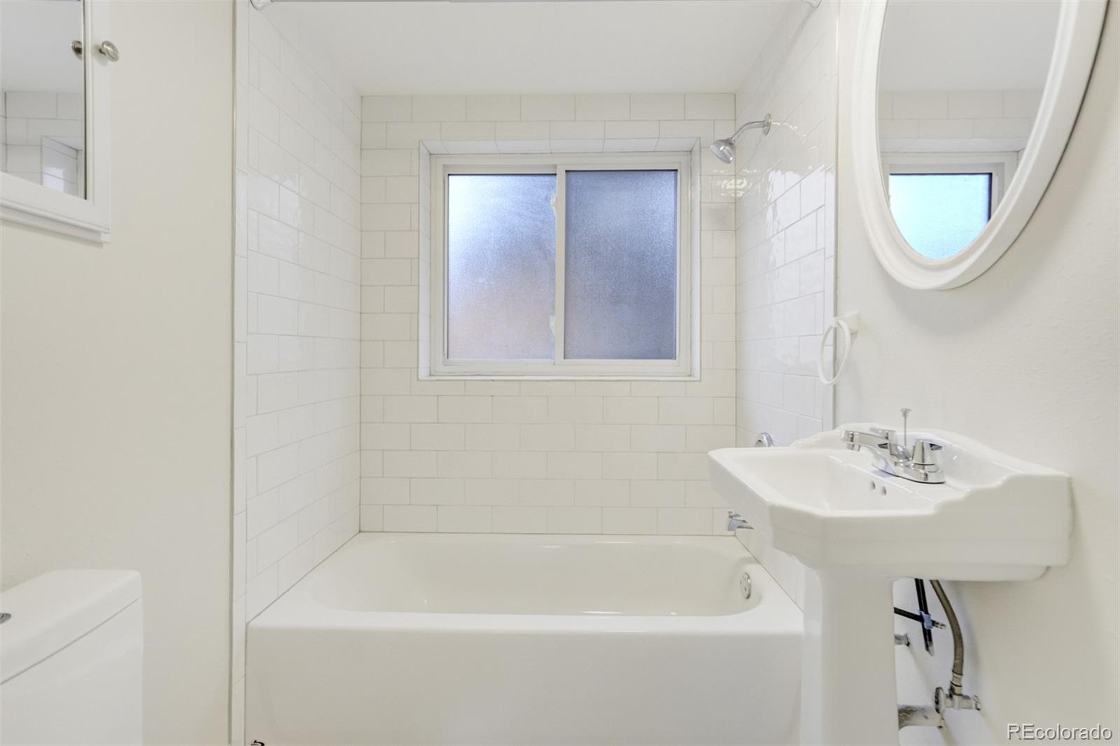 202 Oklahoma Road Manitou Springs, CO 80829 - Photo 26 of 41 a white bath tub sitting next to a white sink
