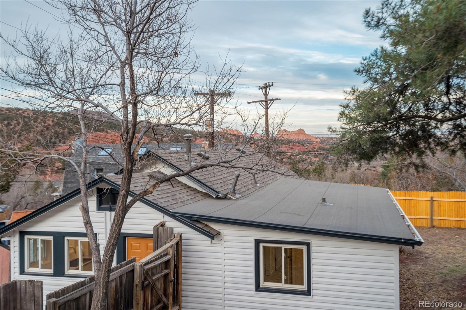 202 Oklahoma Road Manitou Springs, CO 80829 - Photo 39 of 41 a view of a house with a yard and large tree