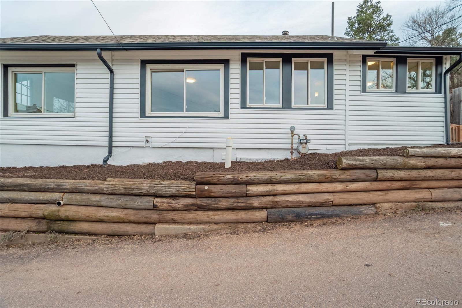 202 Oklahoma Road Manitou Springs, CO 80829 - Photo 6 of 41 a front view of a house with a garage