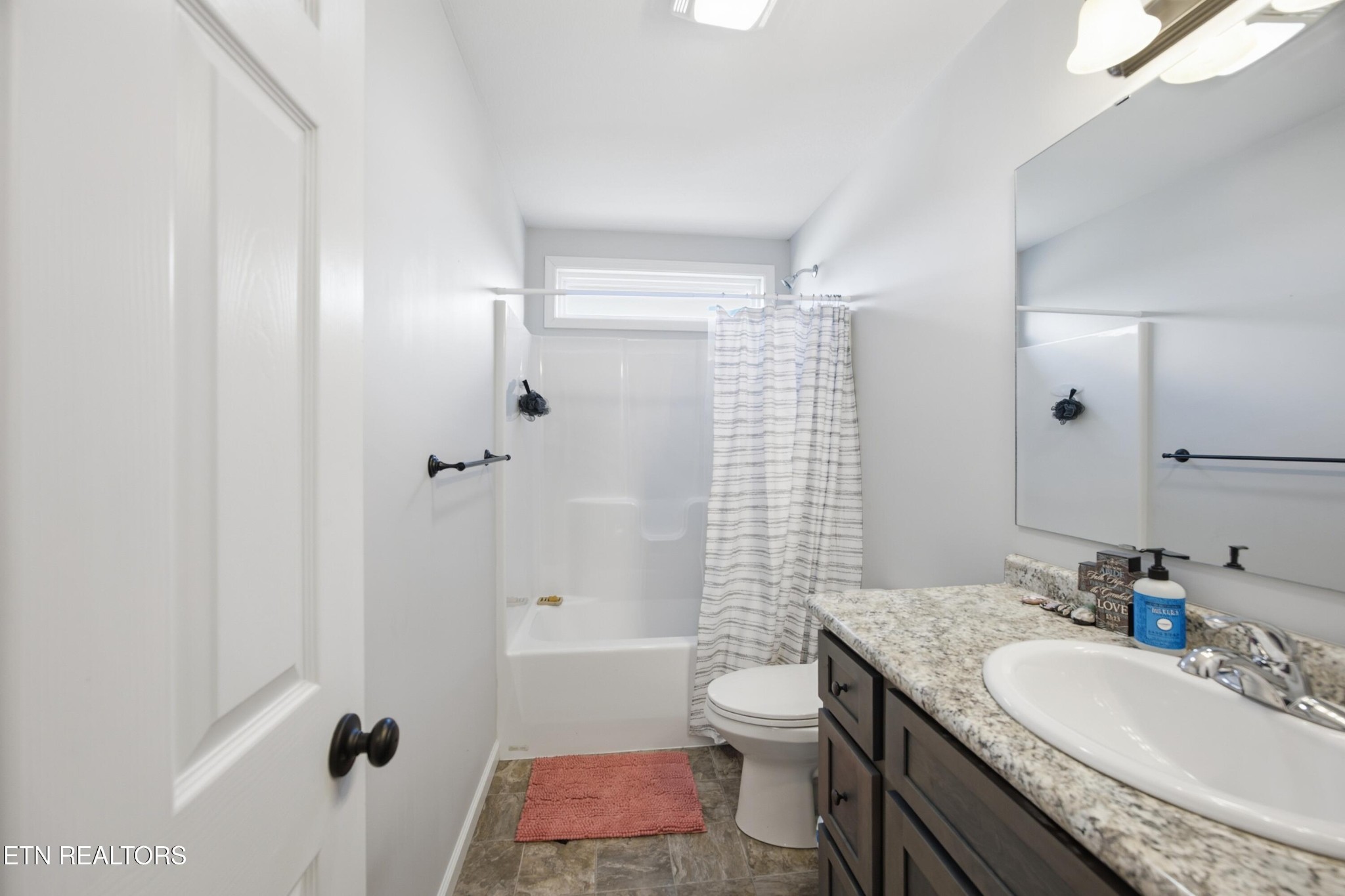 722 Williams Creek Road Oneida, TN 37841 - Photo 14 of 22 a bathroom with a granite countertop sink toilet and shower