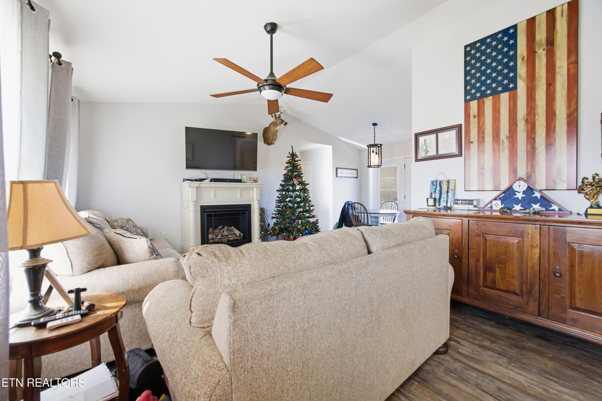722 Williams Creek Road Oneida, TN 37841 - Photo 2 of 22 a living room with furniture a fireplace and a flat screen tv
