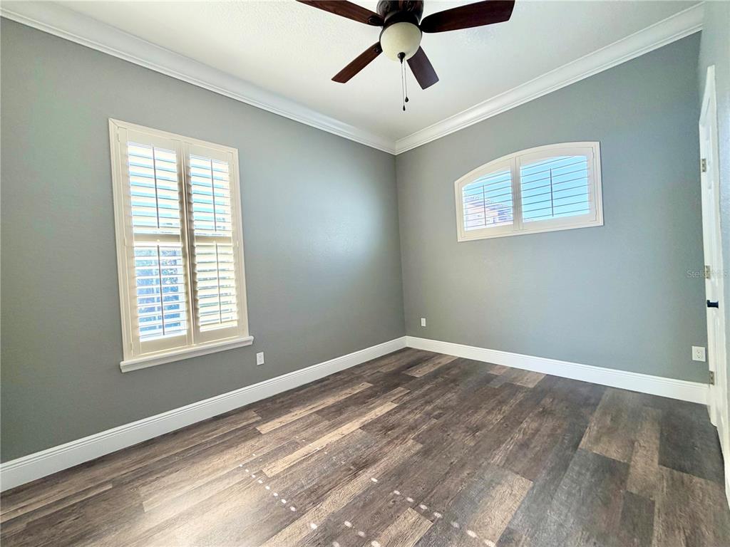 5243 West Lake Butler Road Windermere, FL 34786 - Photo 25 of 43 a view of a big room with windows and chandelier fan