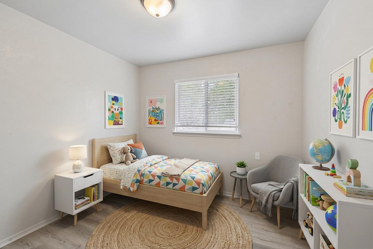 820 Sahara Avenue, Unit B Austin, TX 78745 - Photo 18 of 29 Bedroom featuring light wood-style floors and baseboards