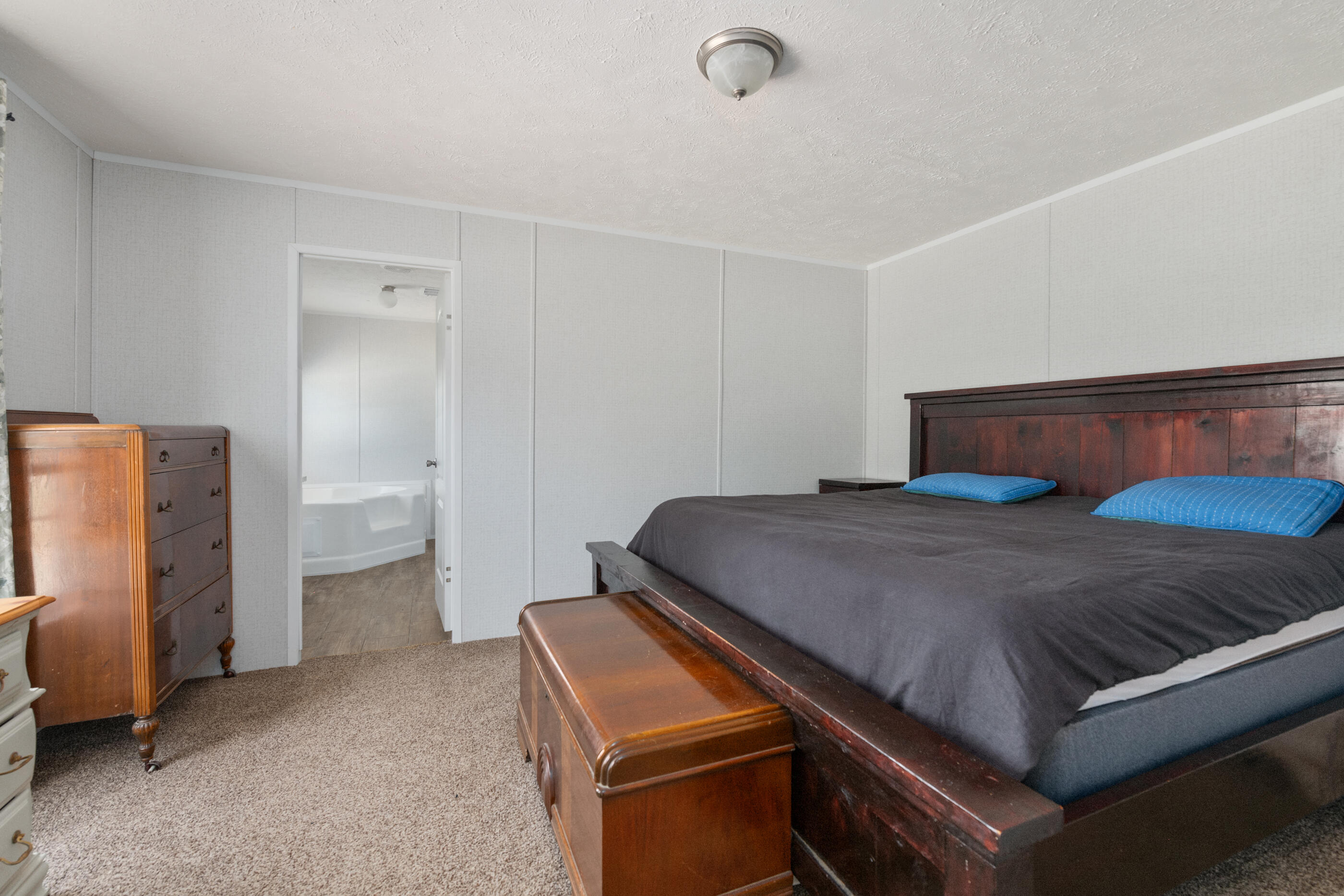 2791 Oakridge Road DeFuniak Springs, FL 32433 - Photo 3 of 10 a bedroom with a bed and cabinets