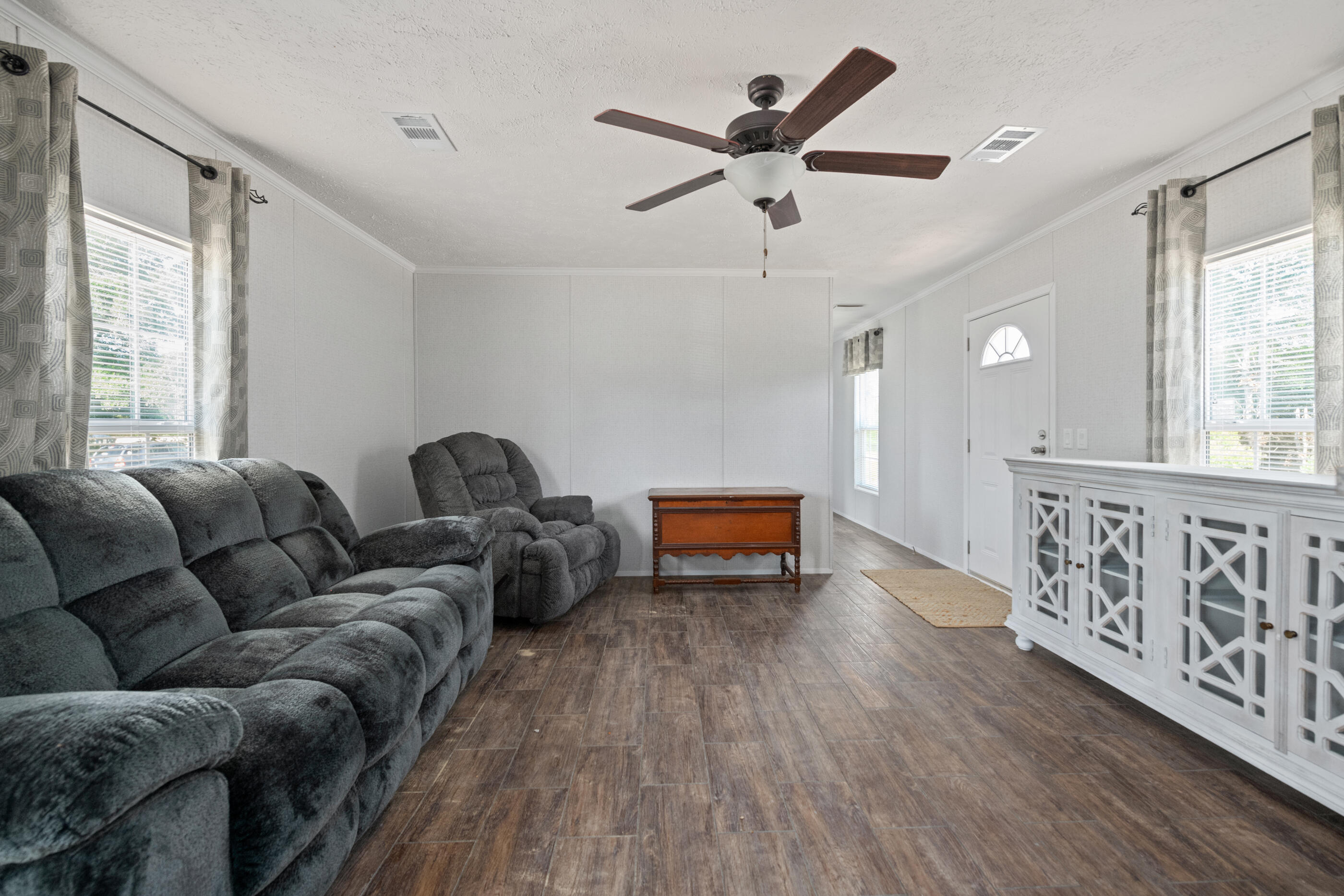 2791 Oakridge Road DeFuniak Springs, FL 32433 - Photo 7 of 10 a living room with furniture and wooden floor